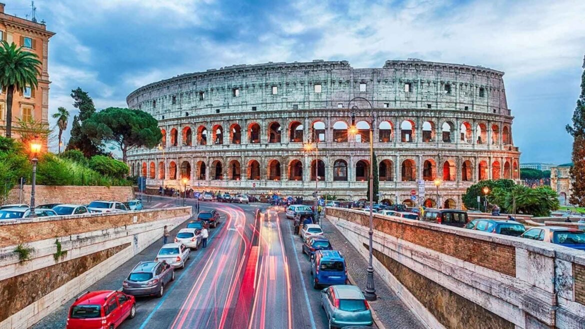 Colosseum in Rome surrounded by golden autumn trees and visitors in October