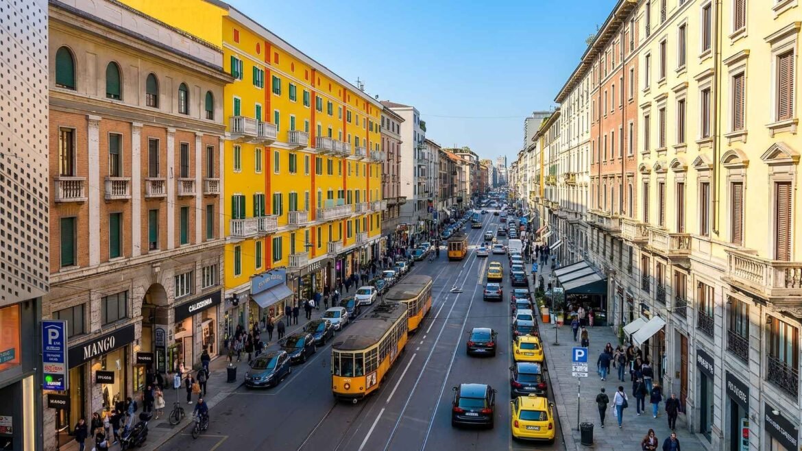A wide daytime view of Corso Buenos Aires in Milan with colorful historic buildings, yellow trams, shoppers, and busy traffic.