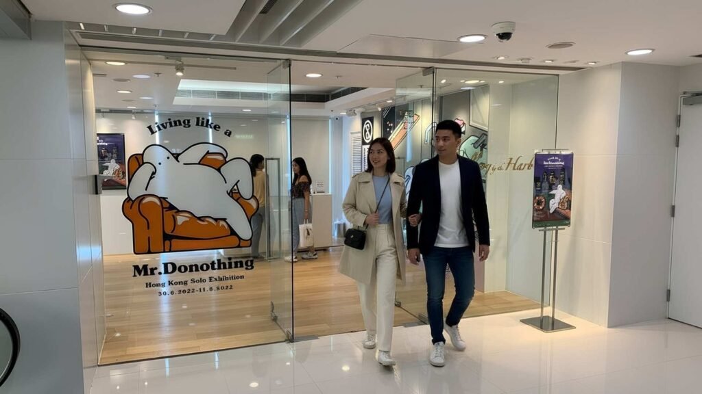 Entrance of Harbour City’s Mr. Donothing solo exhibition with visitors walking in.