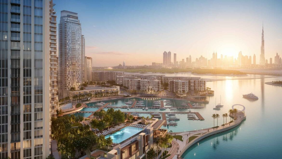 Panoramic view of Dubai Creek Harbour marina at sunset with yachts, waterfront buildings, and Burj Khalifa in the distance