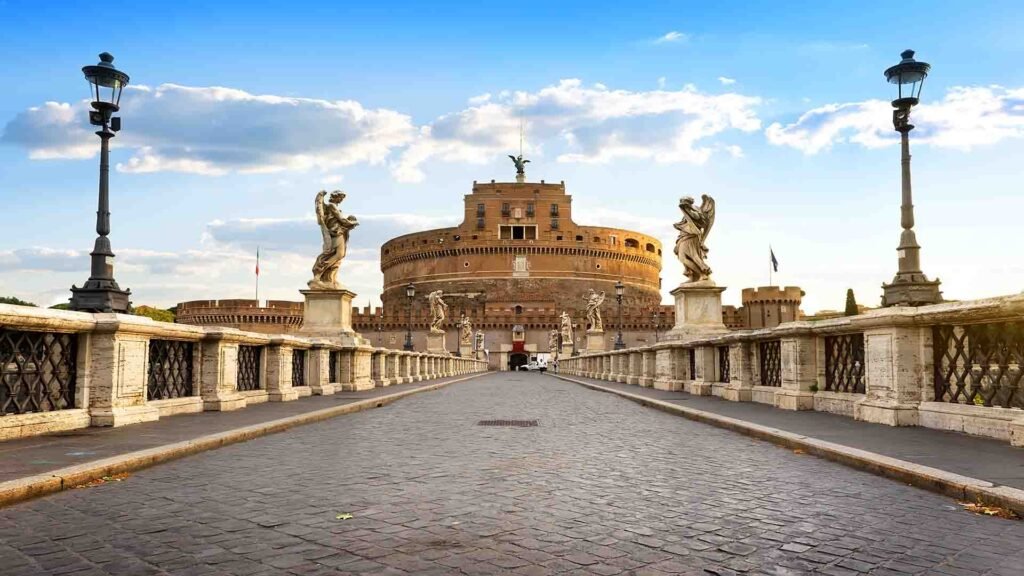 Castel Sant’Angelo in Rome overlooking the Tiber River, showcasing its historic fortress architecture and iconic statue
