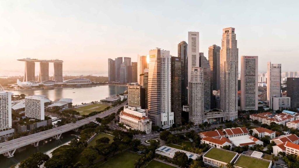 Singapore real estate investment skyline view at sunrise overlooking Marina Bay and modern financial district