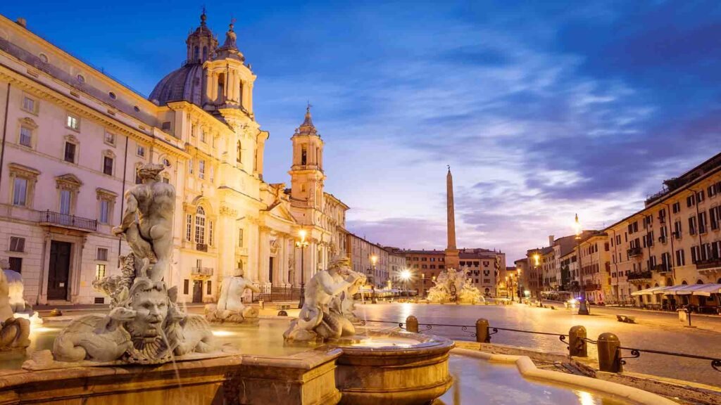 Scenic view of Piazza Navona in Rome featuring baroque fountains, historic buildings, and a lively city square atmosphere