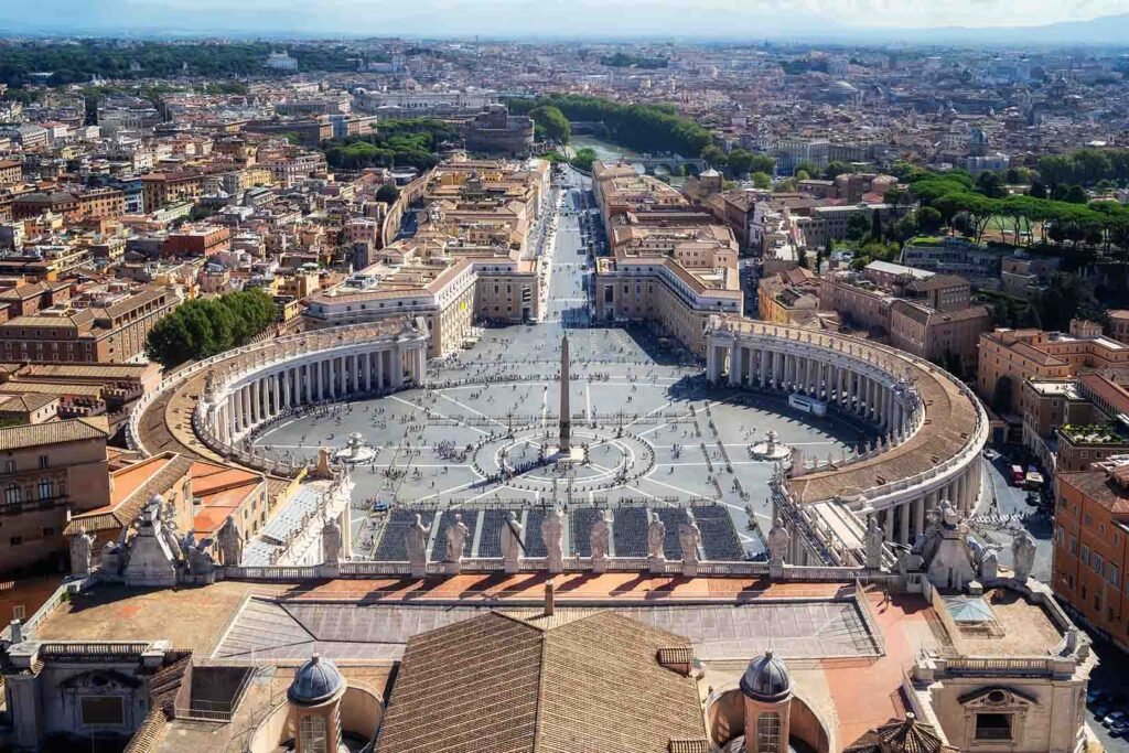Aerial view of Saint Peter’s Square in Vatican City showcasing its iconic colonnades, symmetry, and St Peter’s Basilica
