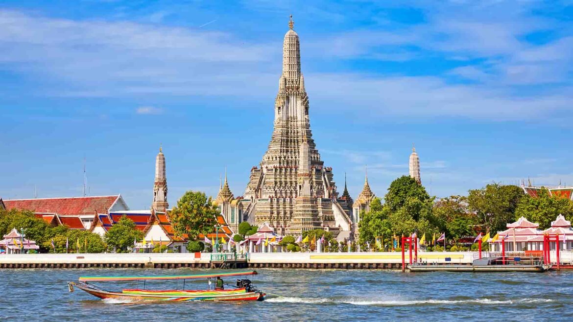 Wat Arun temple along the Chao Phraya River in Bangkok, Thailand