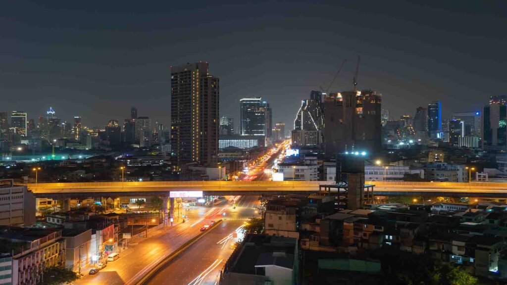 Bangkok downtown city at night showing illuminated skyscrapers and vibrant urban nightlife in Asia