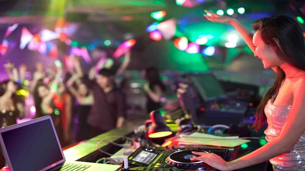 Crowd enjoying DJ-driven clubs and energetic dance floors at night