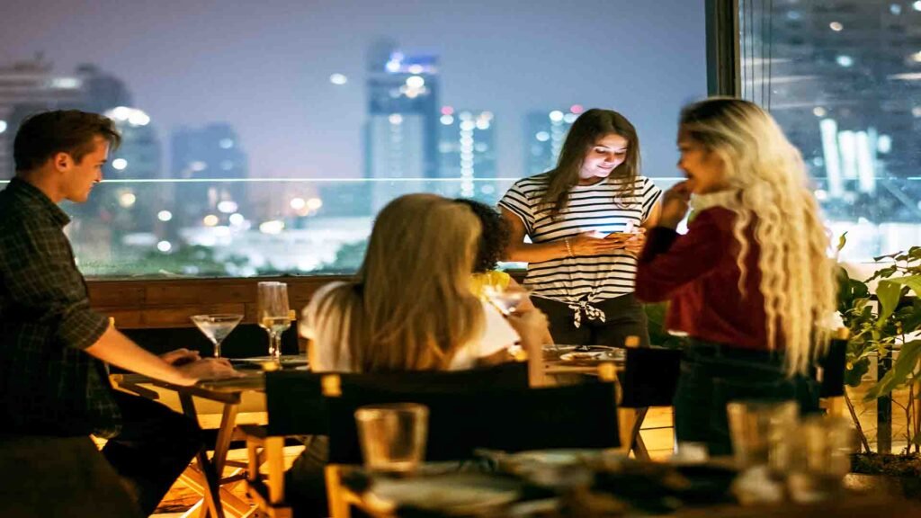 People dancing and enjoying nightlife at a vibrant nightclub in Bangkok, Thailand