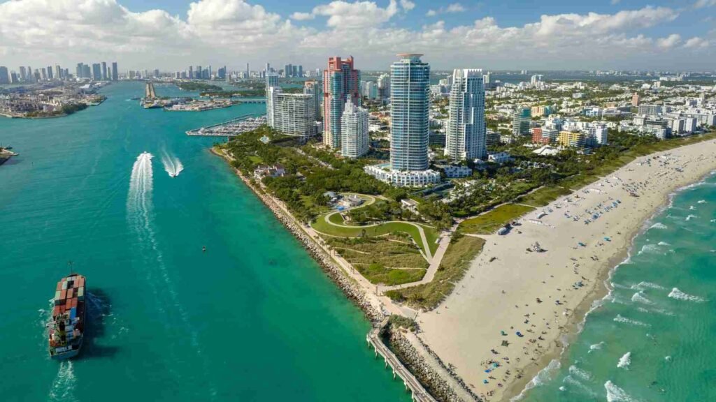 Brickell vs Miami Beach coastline showing residential buildings and beachfront environment, highlighting lifestyle-driven real estate investment market