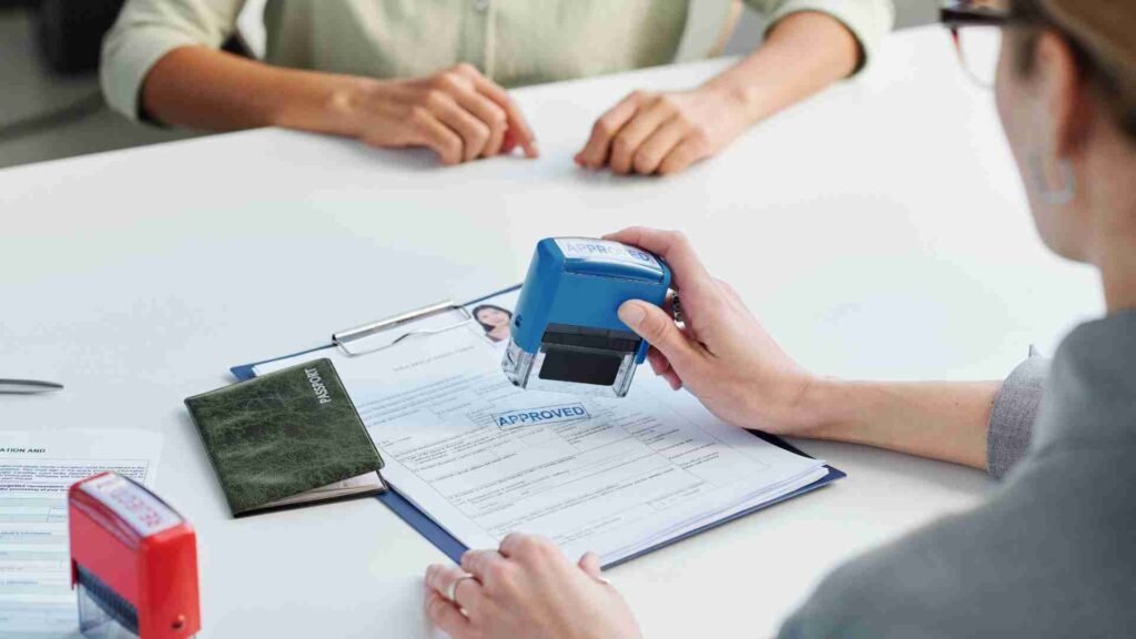 Stamp being placed on an application paper as part of a visa or approval process
