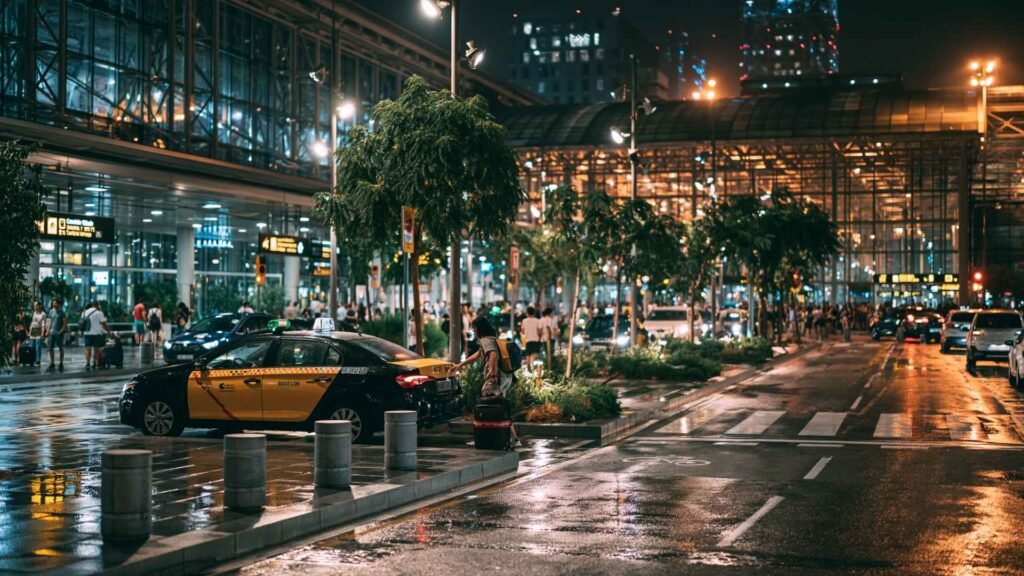 Late-night Barcelona airport taxi transfer outside BCN Airport terminal