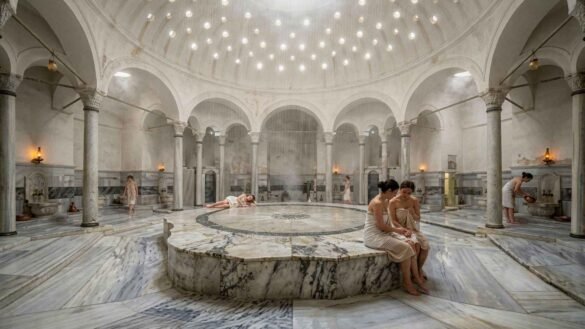 Çemberlitaş Hamamı interior in Istanbul featuring a steam-filled marble chamber beneath a historic Ottoman dome with traditional Turkish hammam atmosphere