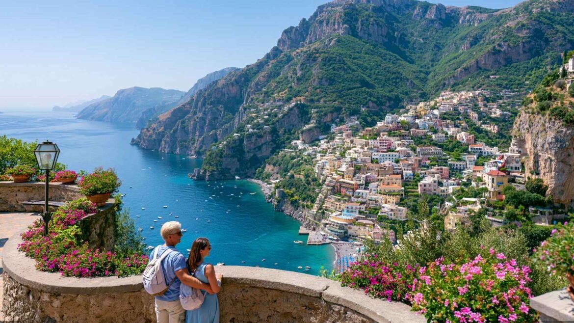 Amalfi Coast on a Budget travelers enjoying a scenic Positano viewpoint overlooking colorful cliffside houses and the Mediterranean Sea
