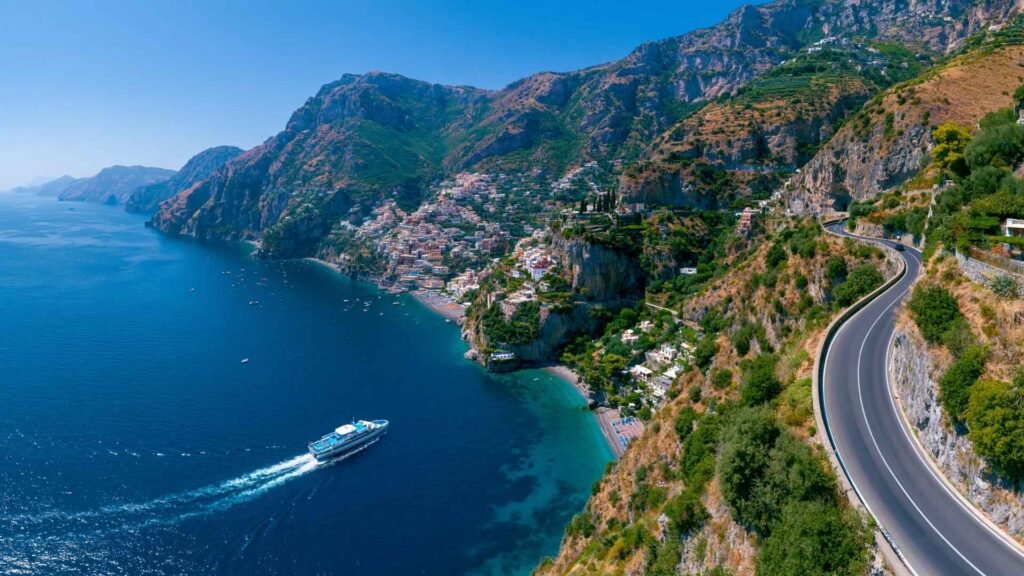 Amalfi Coast coastal road, ferry crossing, and cliffside villages illustrating transportation and accessibility between towns.