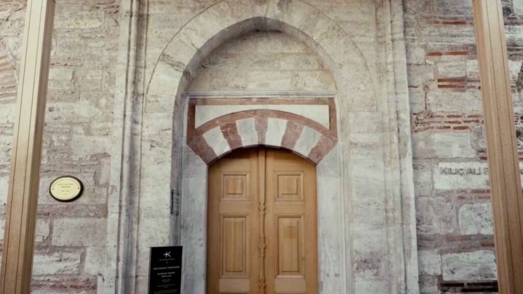 Kılıç Ali Paşa Hamamı entrance featuring Ottoman stone architecture, arched doorway, and historic facade details in Istanbul.