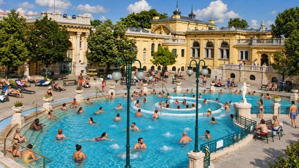 Visitors relaxing in the outdoor pools at Széchenyi Thermal Bath in Budapest